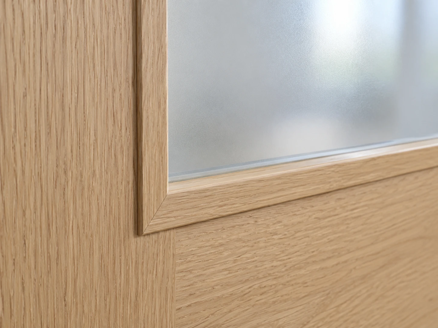 Light oak-finish door with a frosted glass panel and matching woodgrain surround